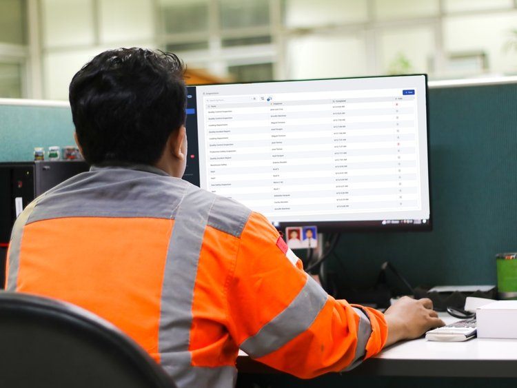 Supervisor viewing quality reports.